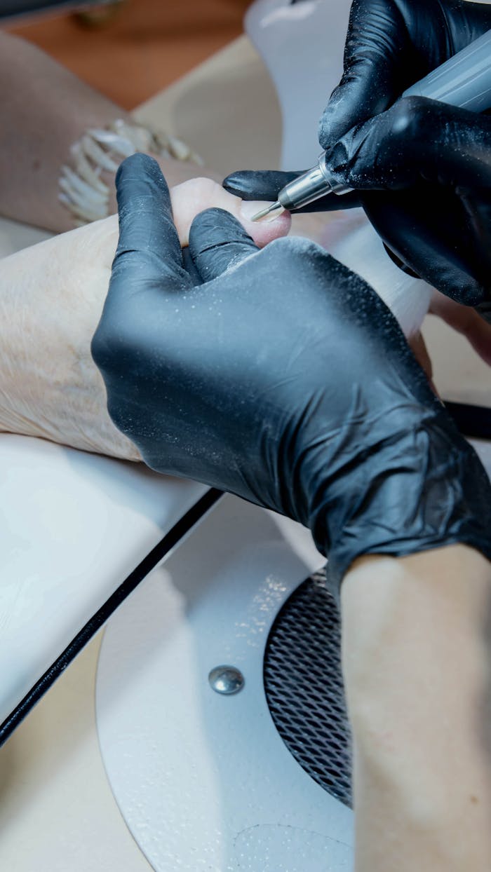 Manicurist Wearing Black Latex Gloves